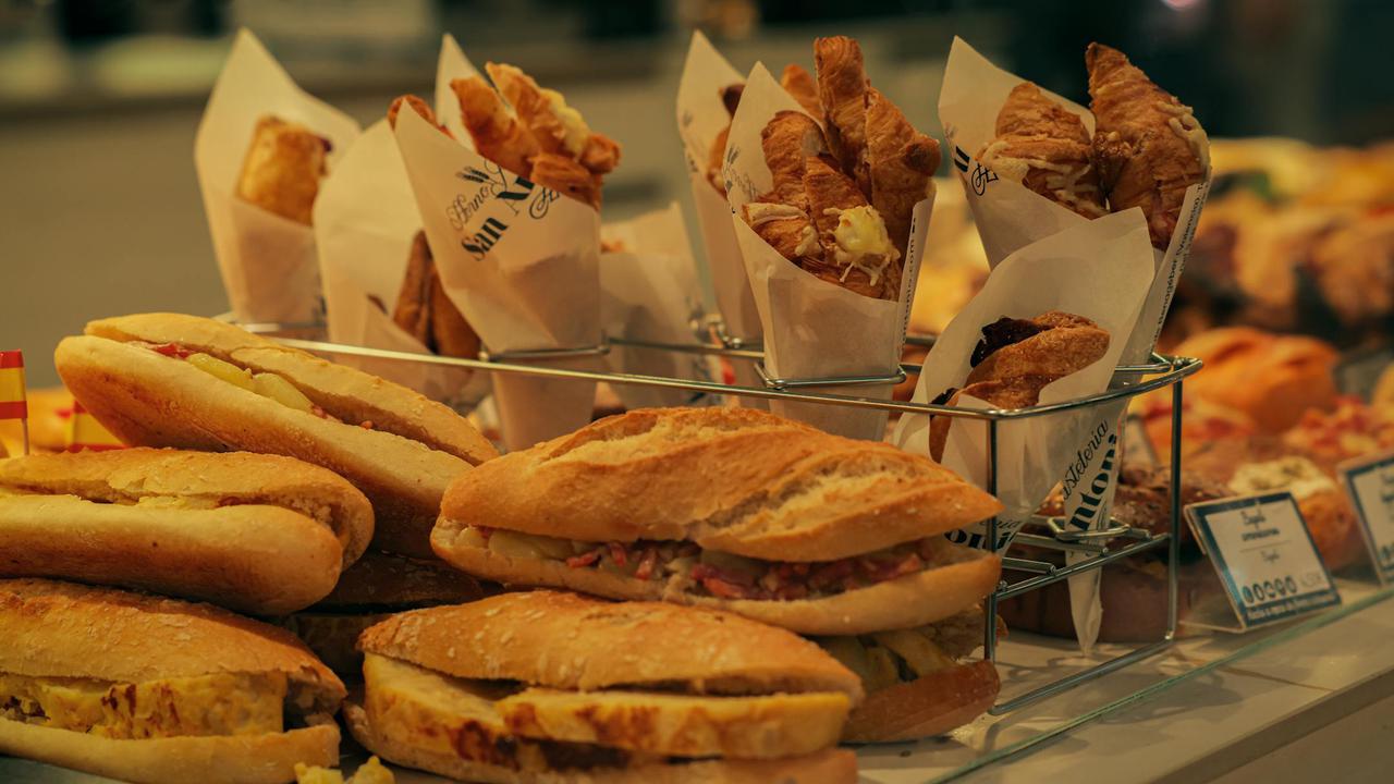 Fresh pastries and sandwiches on display at a bakery in Valencia, Spain.
