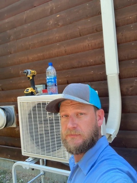 Owner of Thermal Solutions LLC with professional HVAC equipment