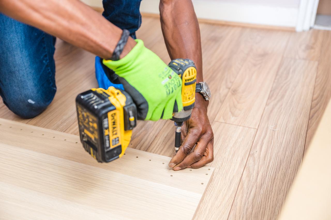 person-holding-dewalt-cordless-hand-drill-1249610.jpg