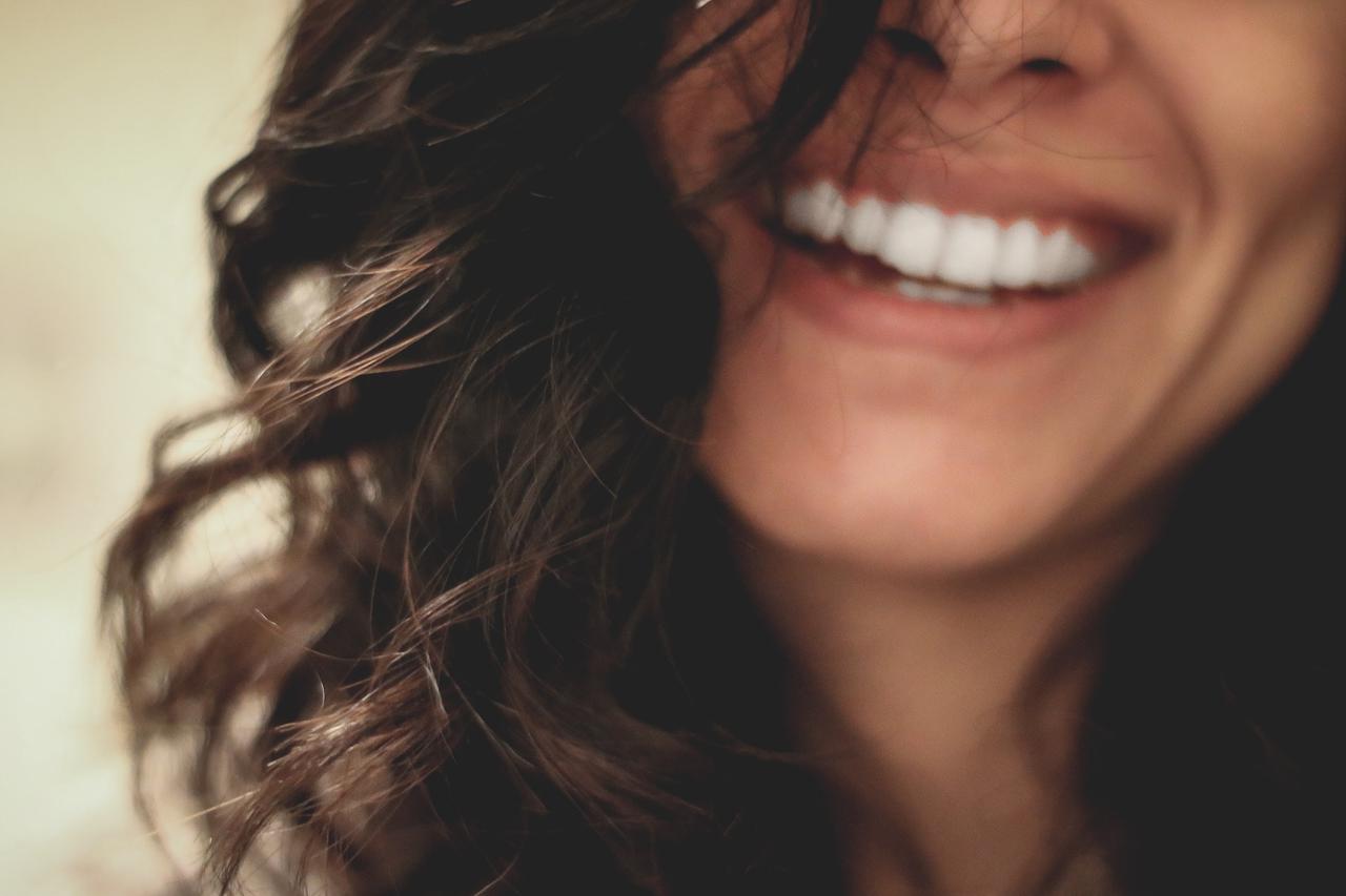 A woman smiling.