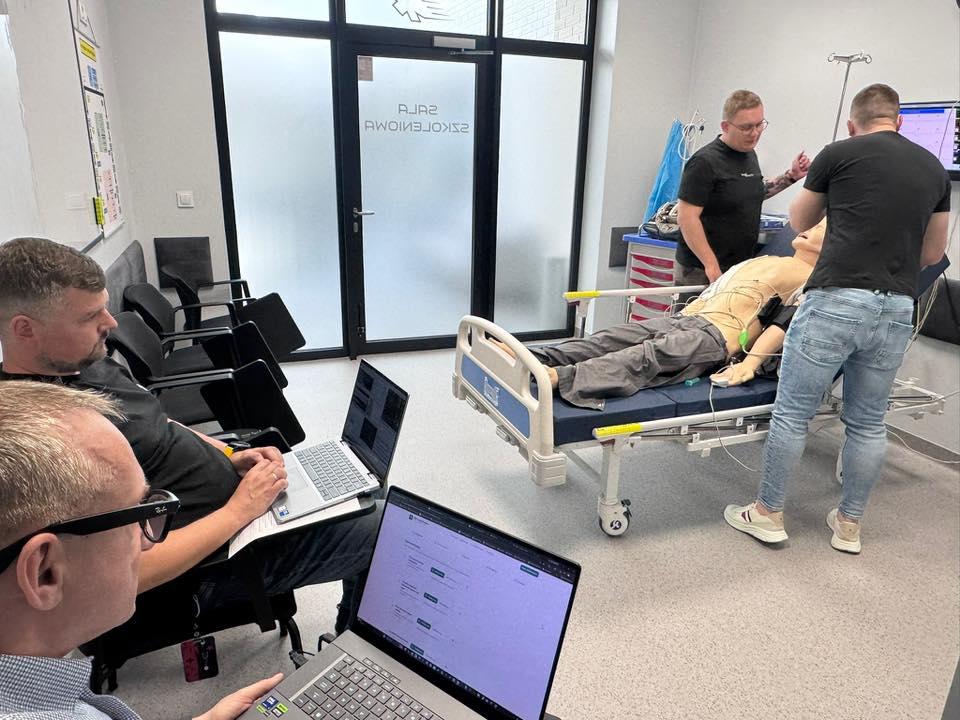 Emergency medical services team conducting high-acuity patient care in operational environment