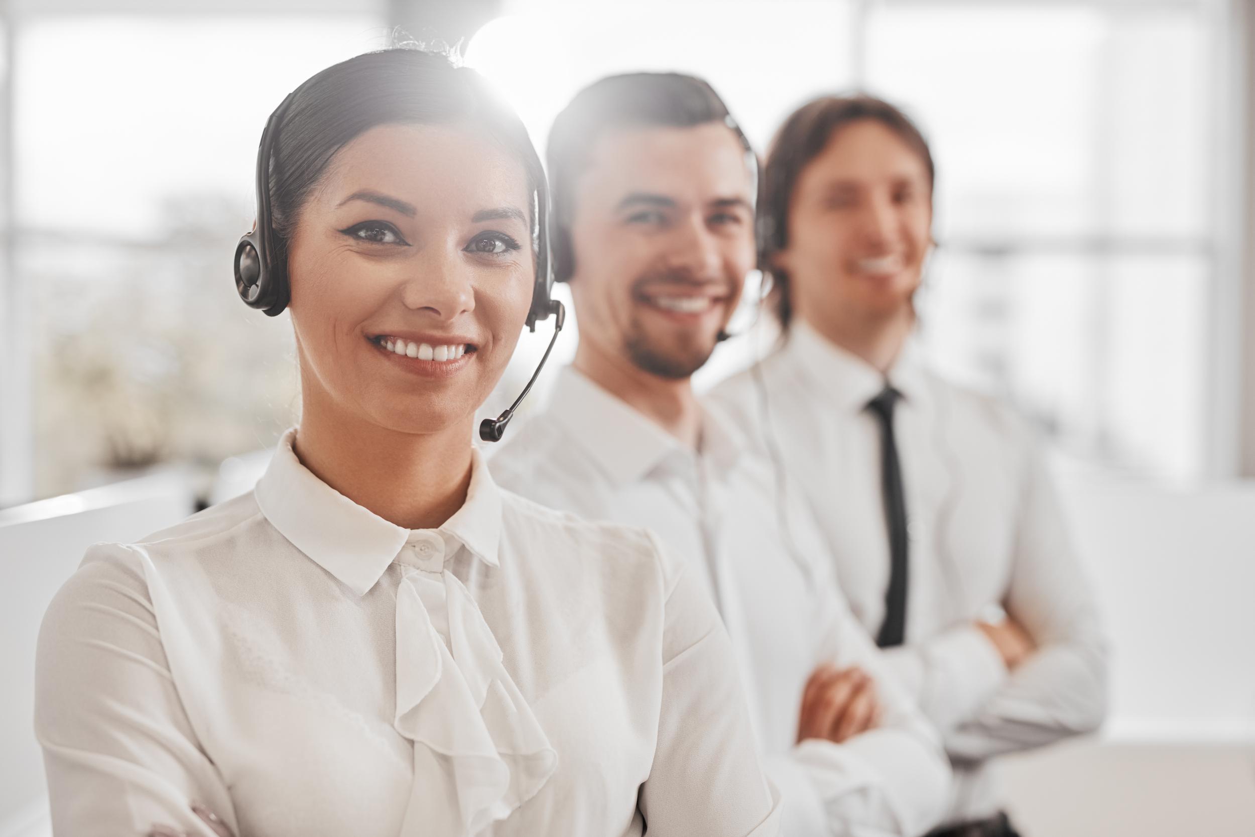 ethnic-call-center-agent-near-colleagues-2025-03-16-12-41-54-utc.jpg