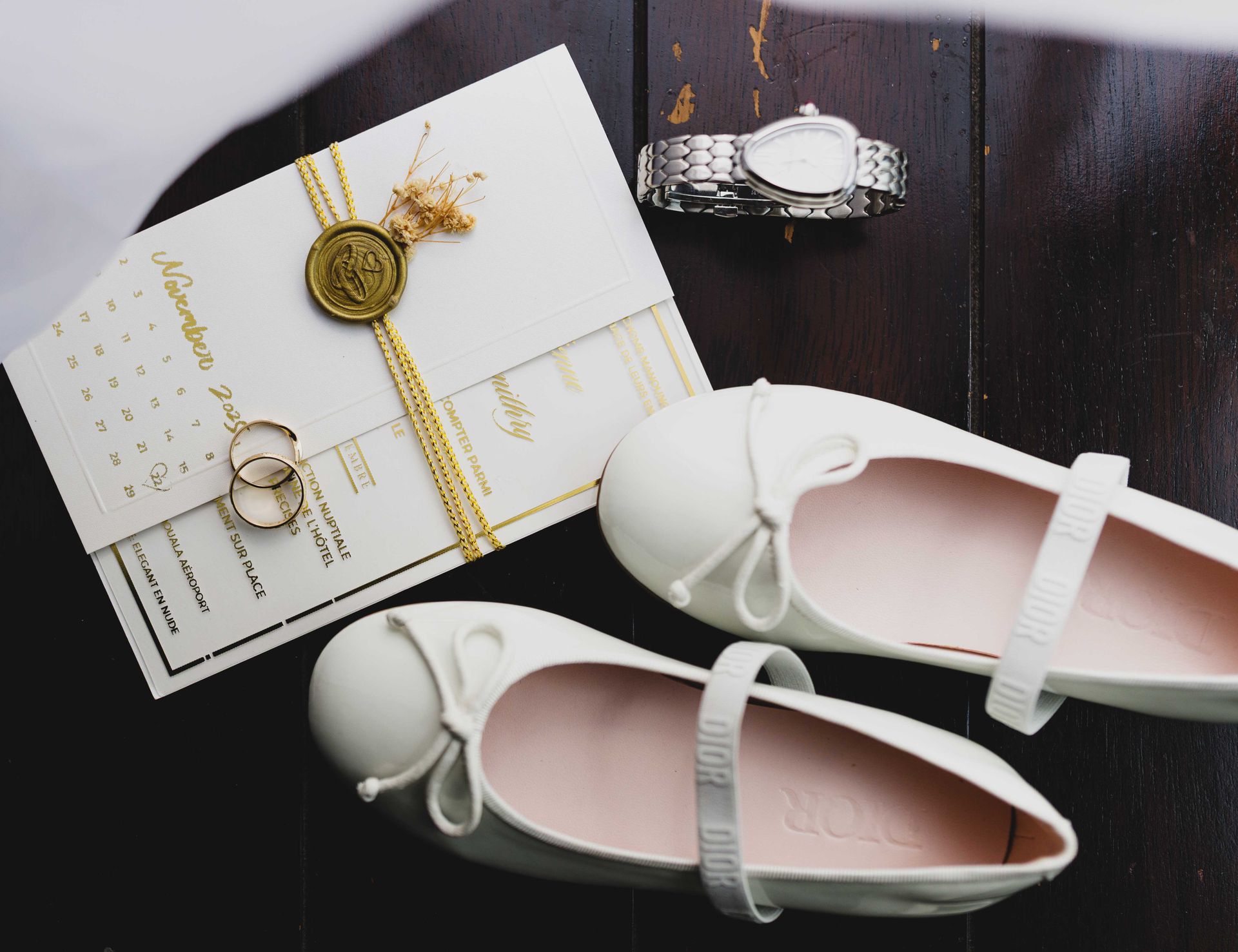 Design studio flat-lay: fabric swatches, letterpress stationery, dried florals and color palette cards