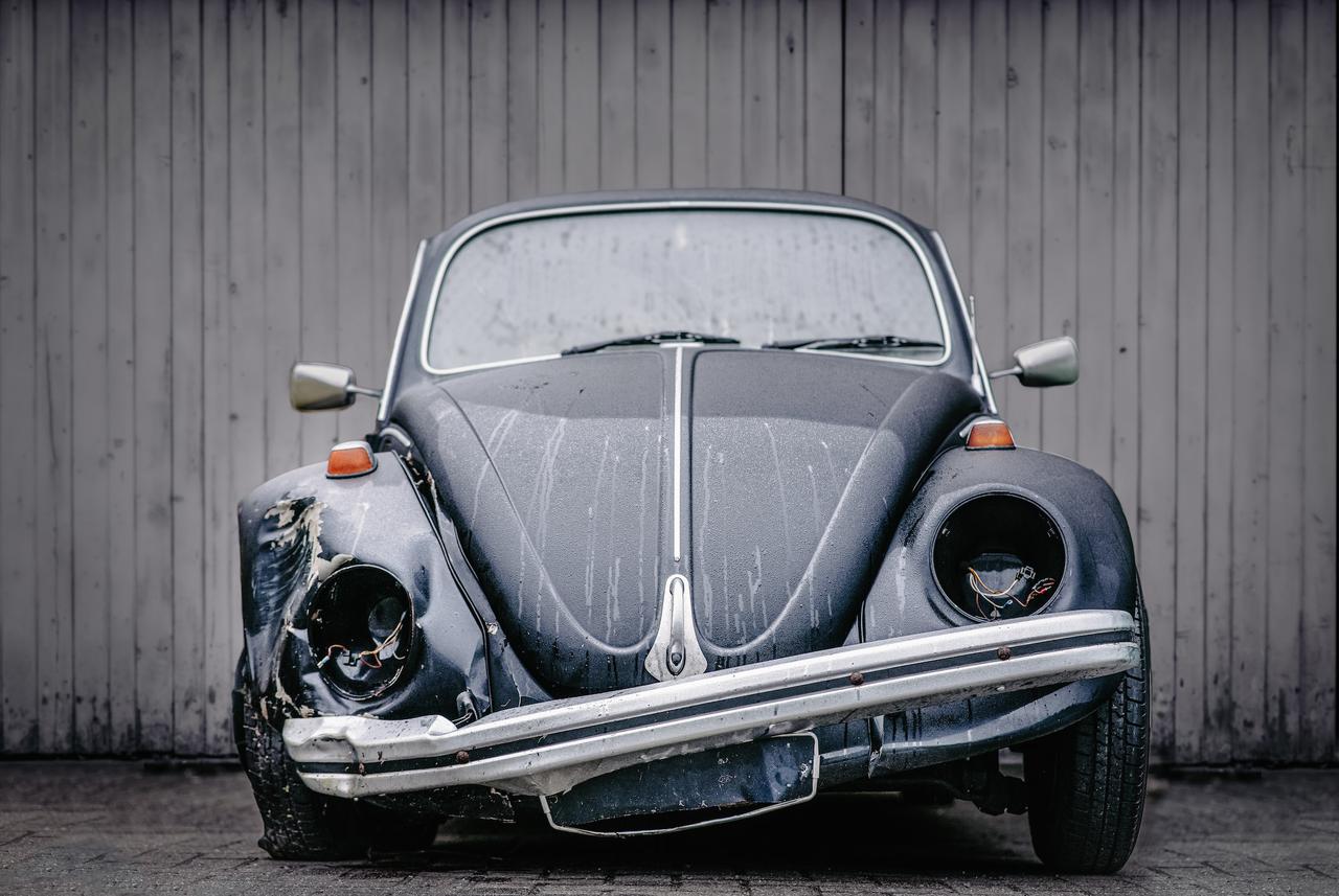 Volkswagen Beetle with damage to the front.  