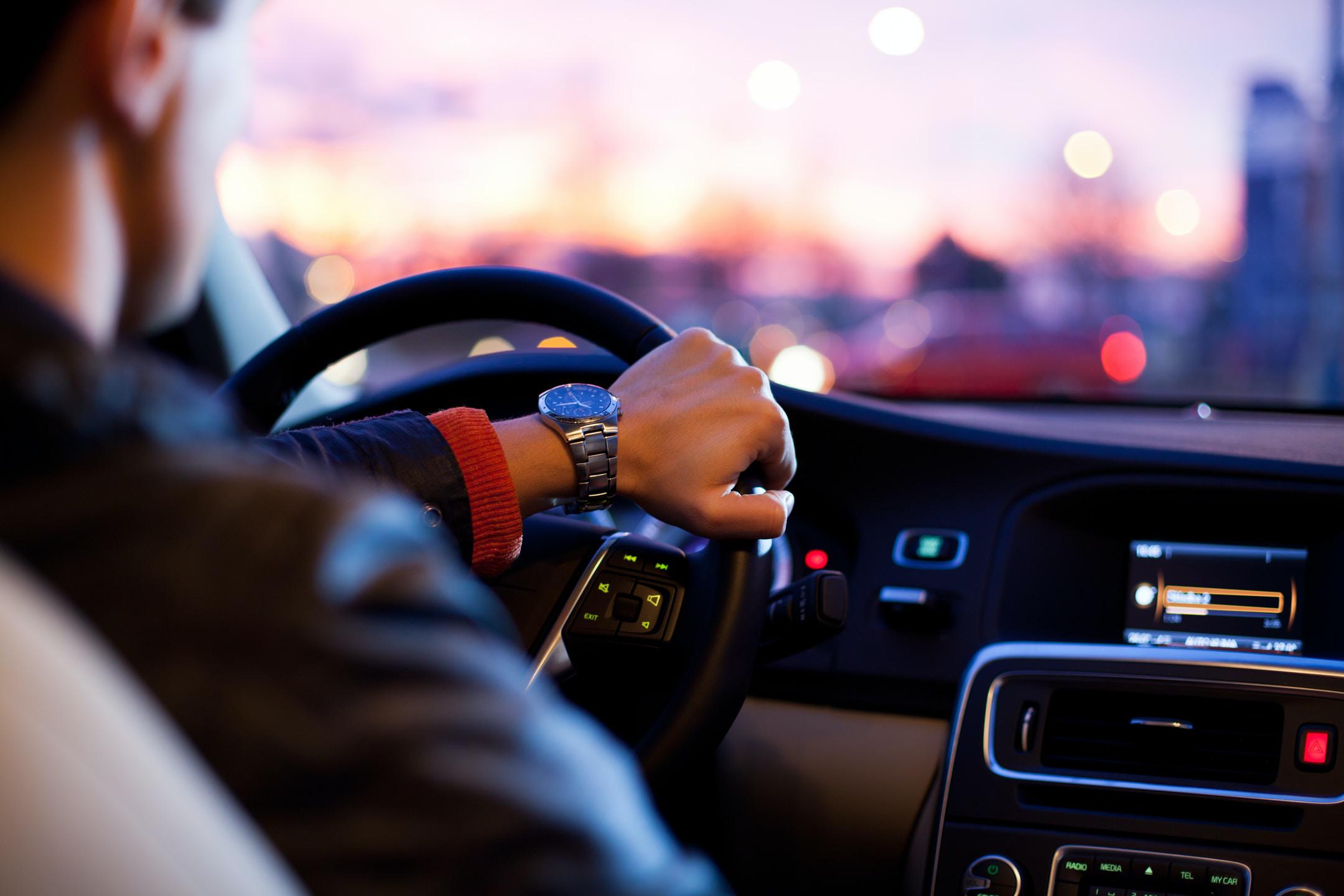 Hand on steering wheel.