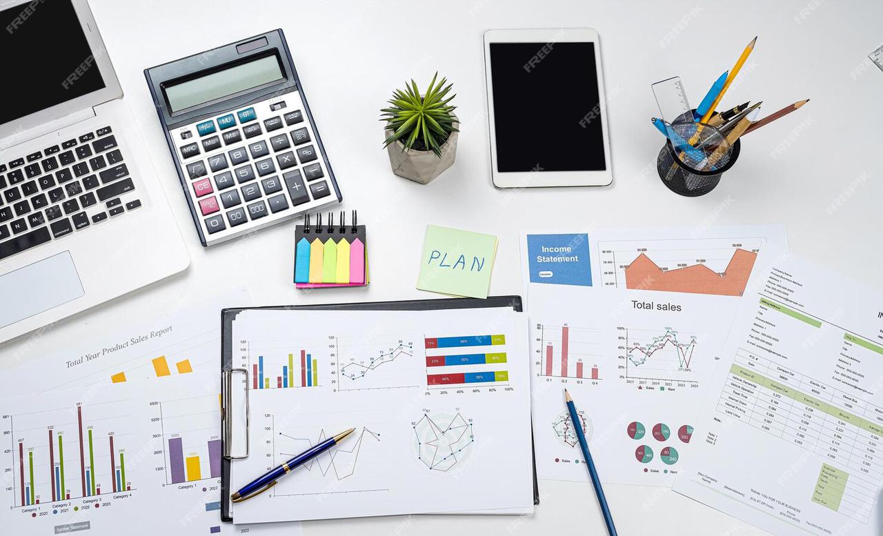 business-office-desk-with-graph-annual-report-with-laptop-pen-calculator-business-financial-accounting-concept_359031-38100.jpg