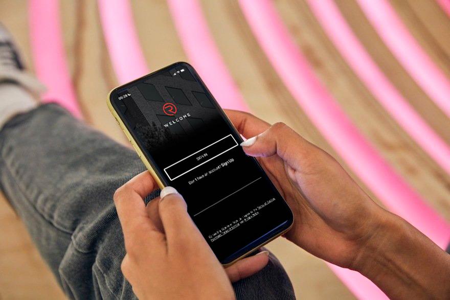 regent pm app welcome screen (holding phone in hand).jpg