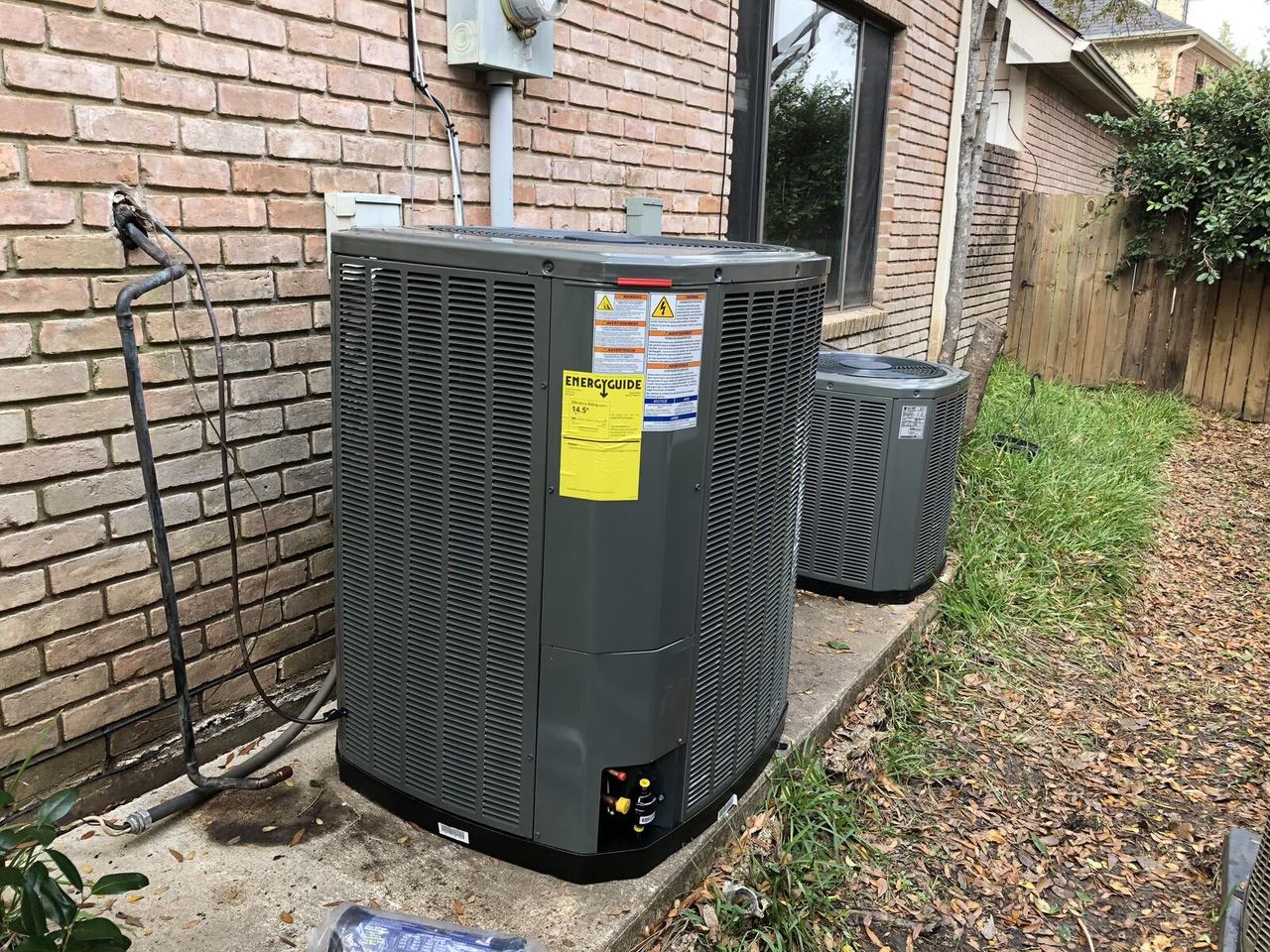 Newly installed Trane 14.5 SEER AC condenser with EnergyGuide label in Spring, TX