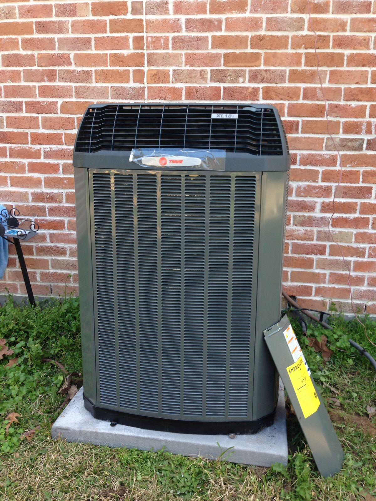 Trane XL18i high-efficiency air conditioner condenser installed at a brick home in Spring, TX