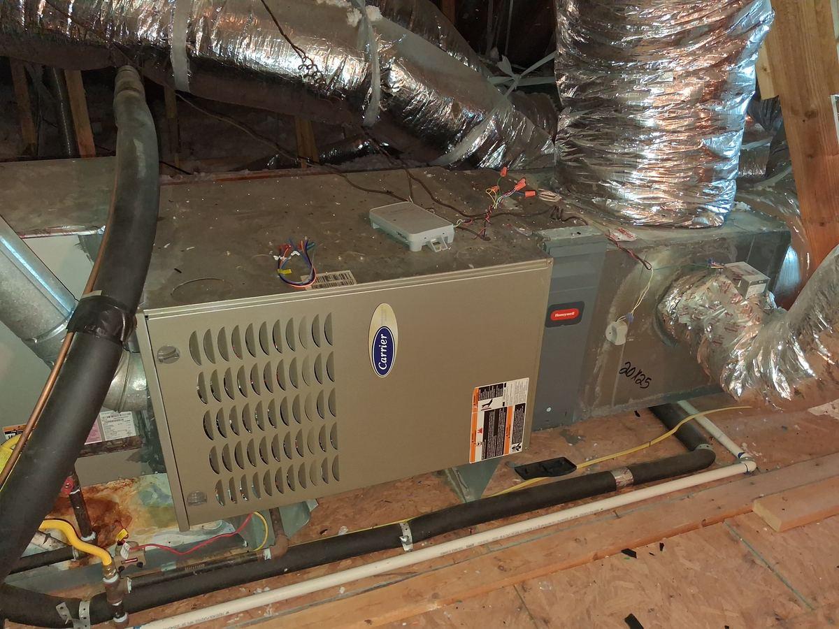 Old attic air handler before AC replacement in Spring TX