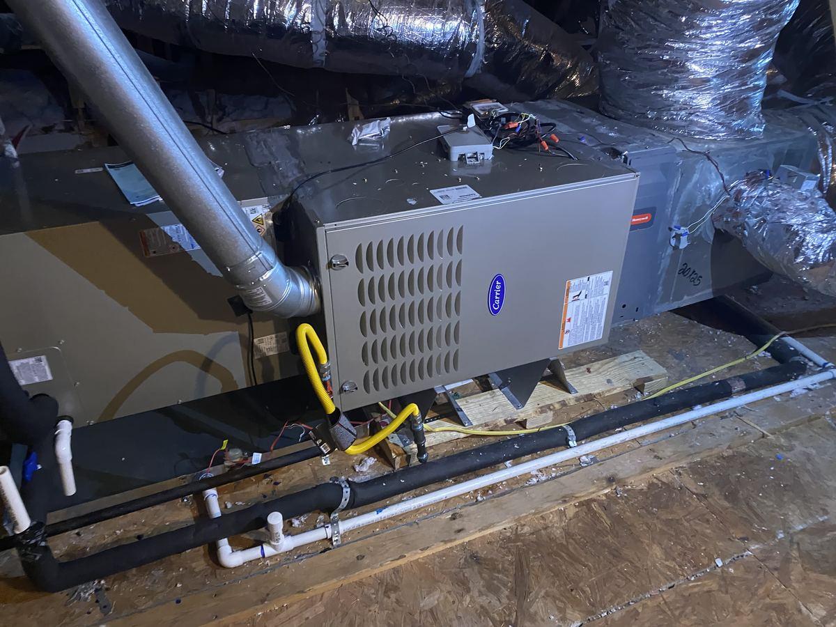Completed variable-speed AC installation Spring TX with condensate line and refrigerant lines
