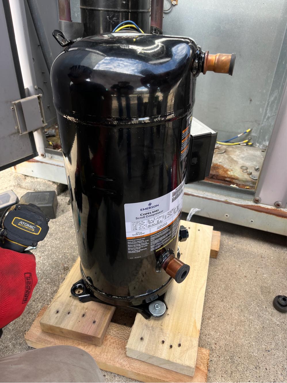 New replacement compressor staged and ready for installation