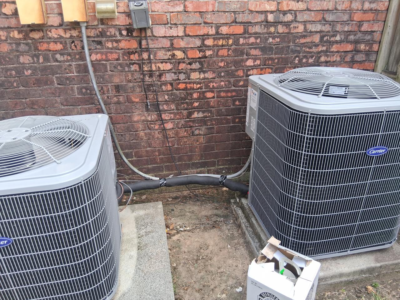Dual Carrier Comfort 16 condenser system installed side by side