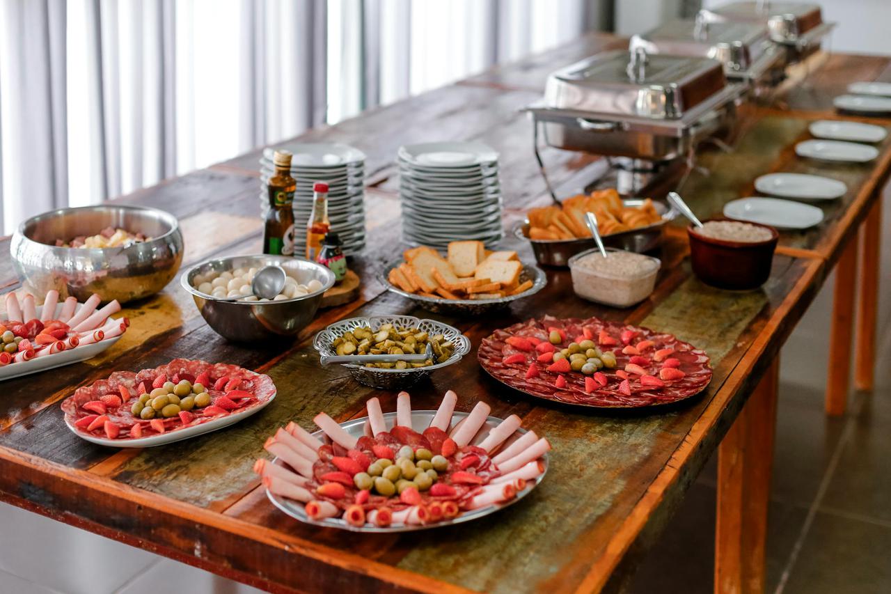 A sophisticated buffet spread featuring various meats, cheeses, and appetizers indoors.