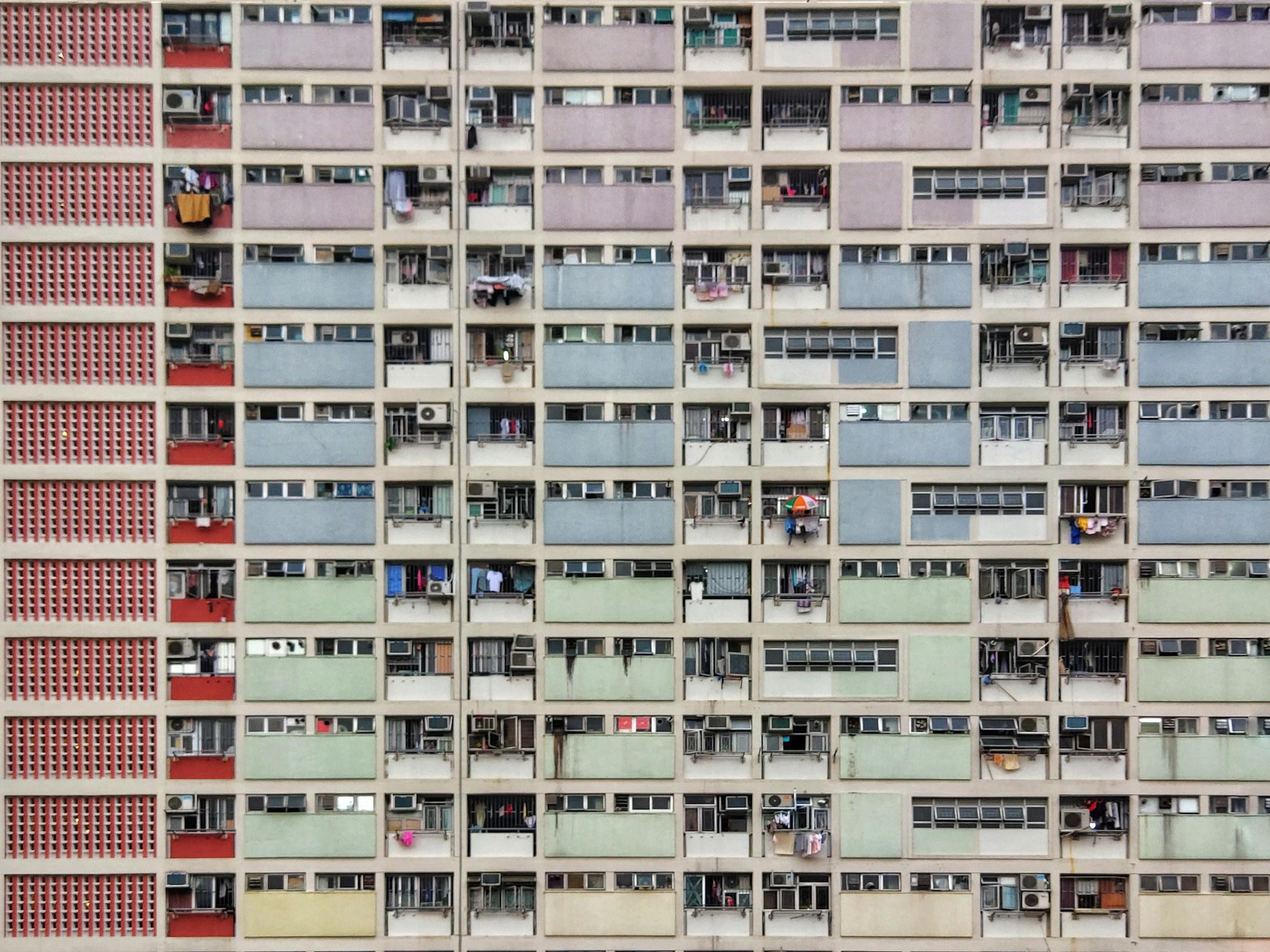 Oh, this is such a typical photo, but I just couldn't resist taking it. Everyone around me at the moment was people also trying to make this shot, and for a moment I felt incredible unity with them. This one is not particularly clear either, so I hope you can forgive me. 
The address is Hong Kong, Choi Hung Estate besides the eponymous MTR station. Just follow the signs and enter the estate (there's no fence or guards), walk to the car park and take the stairs all the way up. You'll discover a basketball co