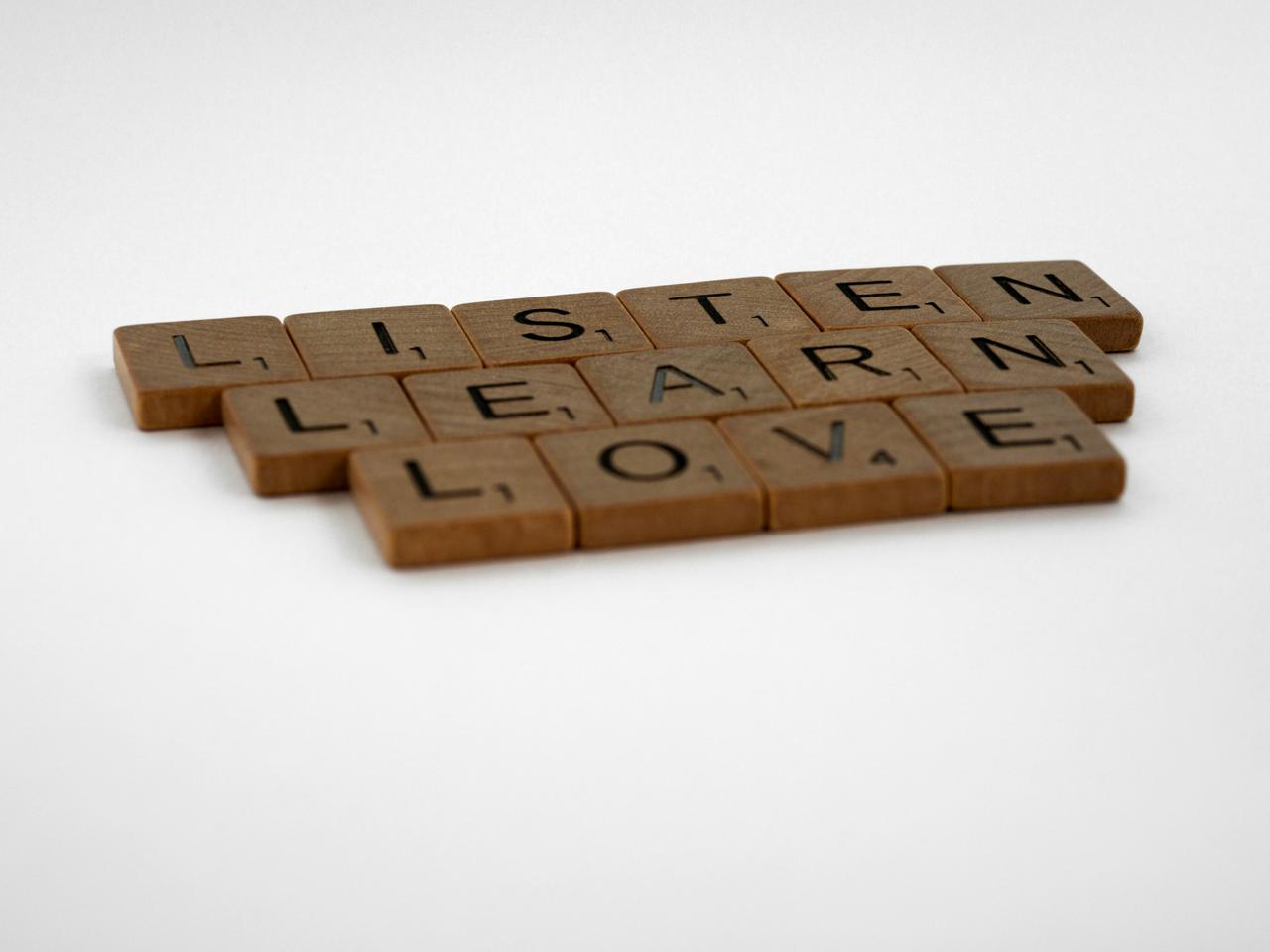 scrabble, scrabble pieces, lettering, letters, wood, scrabble tiles, white background, words, quote, letters, type, typography, design, layout, focus, bokeh, blur, photography, images, image, listen, learn, love, listen learn love, counselling, counseling, counselor, counsellor, therapy, help, depression, trouble, 