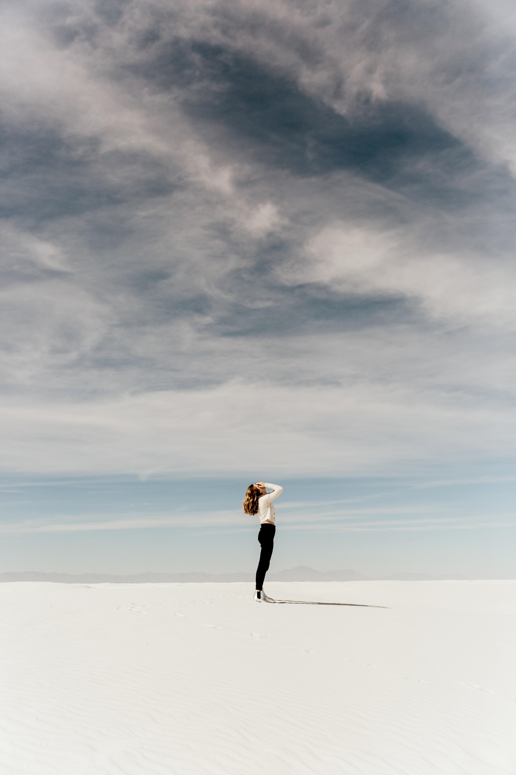 Image of a woman in a desert, the way it feels when you&#x27;re looking for relief from biomagnetism therapy.