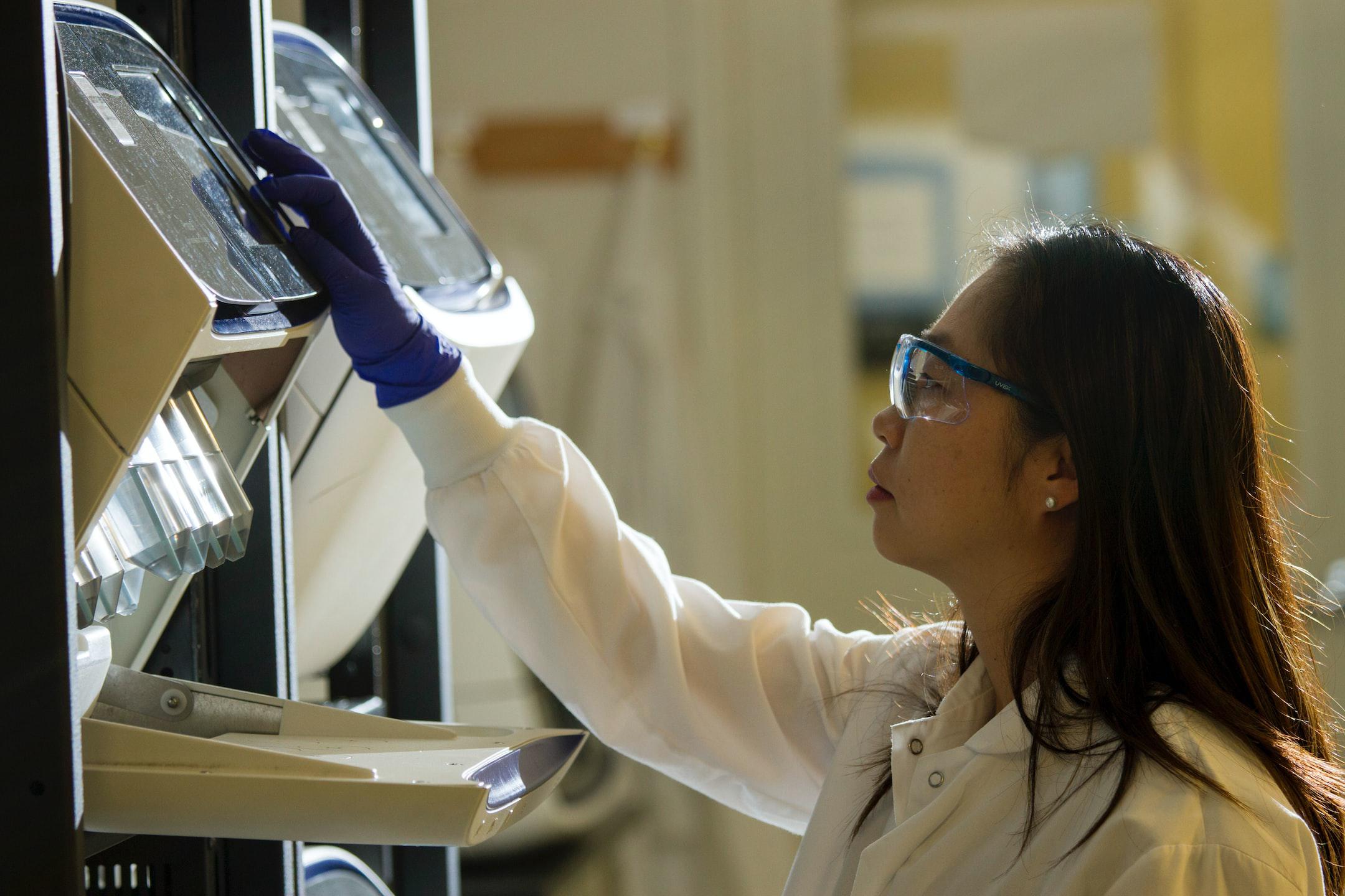 DNA Genotyping and Sequencing. Technician prepares for a viral whole-genome sequencing experiment at the Cancer Genomics Research Laboratory, part of the National Cancer Institute's Division of Cancer Epidemiology and Genetics (DCEG).