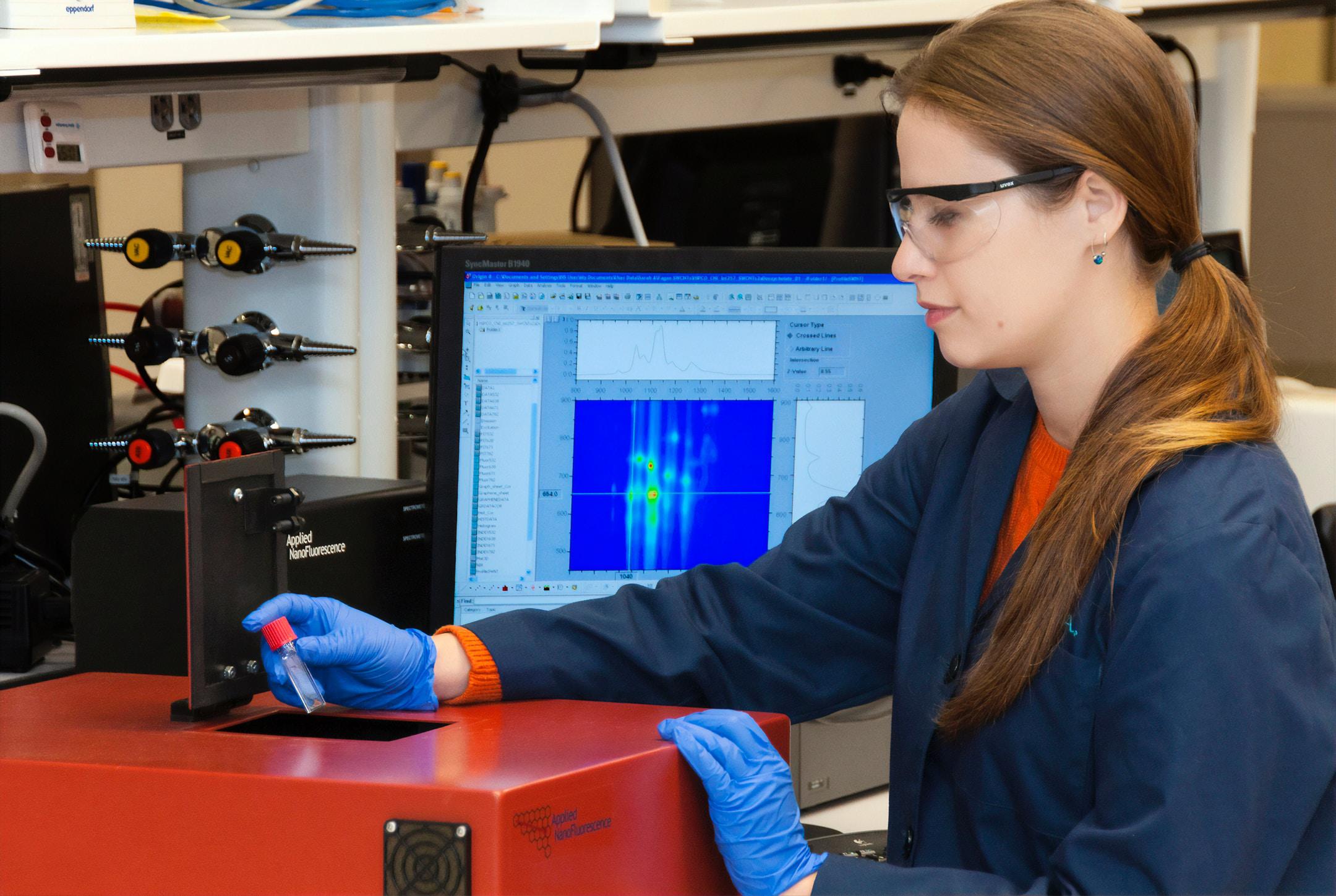 A technician using a nano-spectralizer (fluorescence microscope) at the Advanced Technology Research Facility (ATRF), Frederick National Laboratory for Cancer Research, National Cancer Institute.
