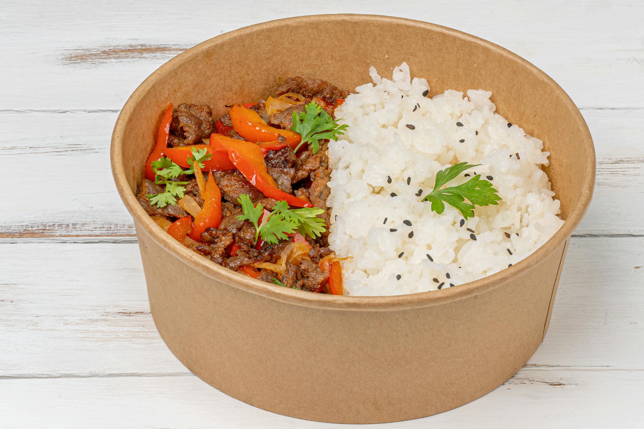 Close-up of a flavorful beef and vegetable rice bowl perfect for lunch.