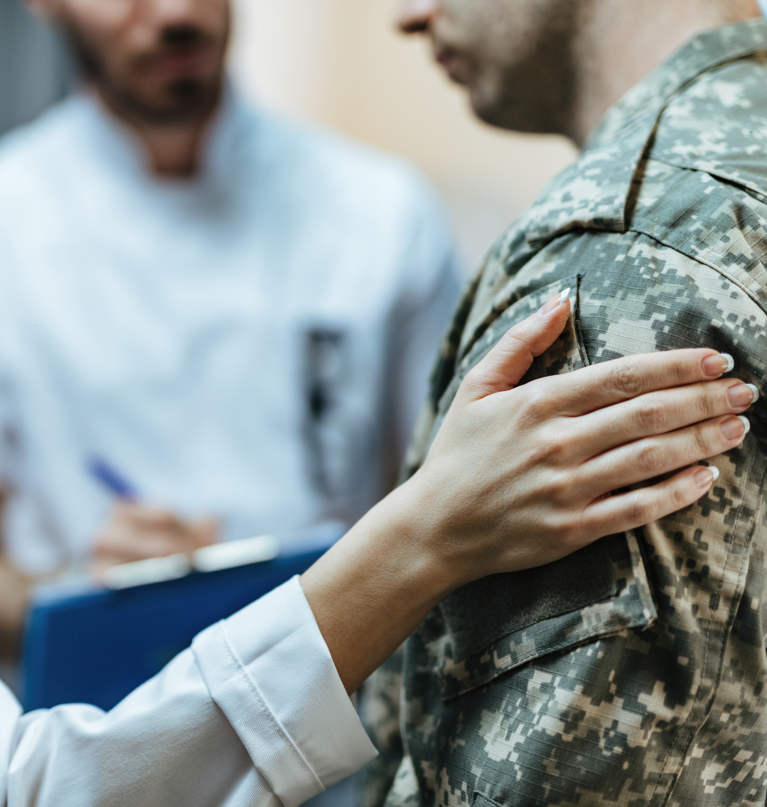 closeup-soldier-being-consoled-by-healthcare-workers-clinic-1738505479219.jpg
