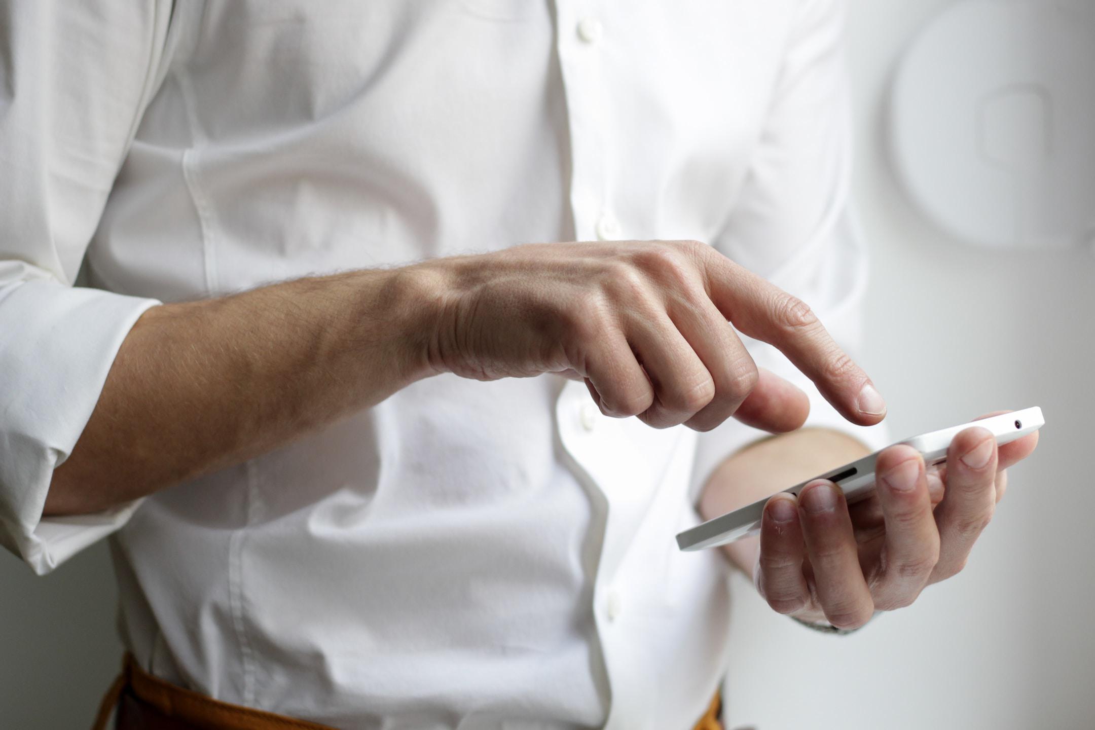 employee accessing his company's unified communication system on his smartphone