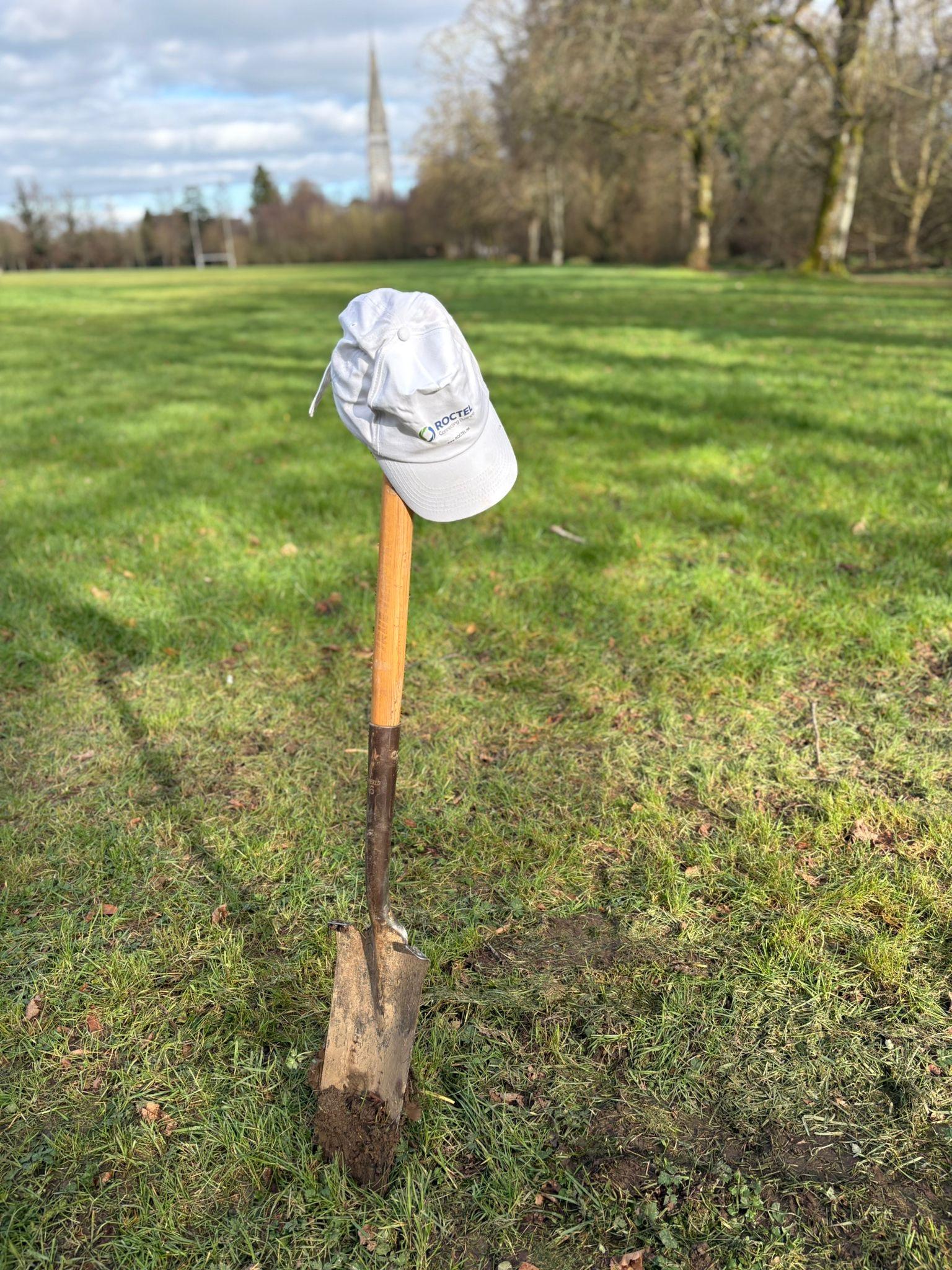 roctel cap on shovel tree planting 2026.jpg
