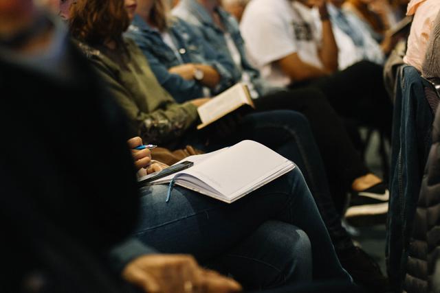 Students in an adult learning center taking notes