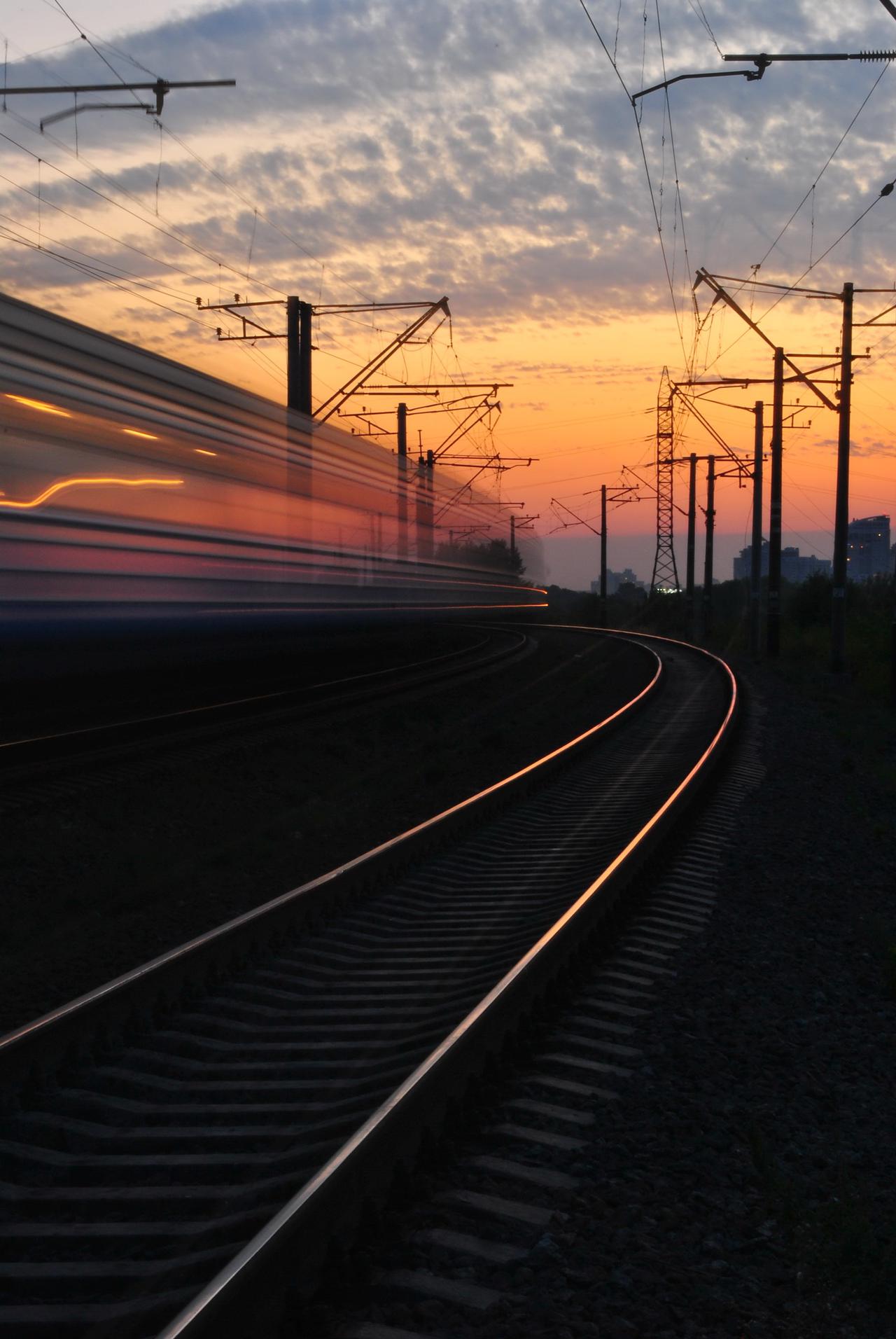rail-road-under-gray-and-orange-cloudy-sky-during-sunset-163856.jpg