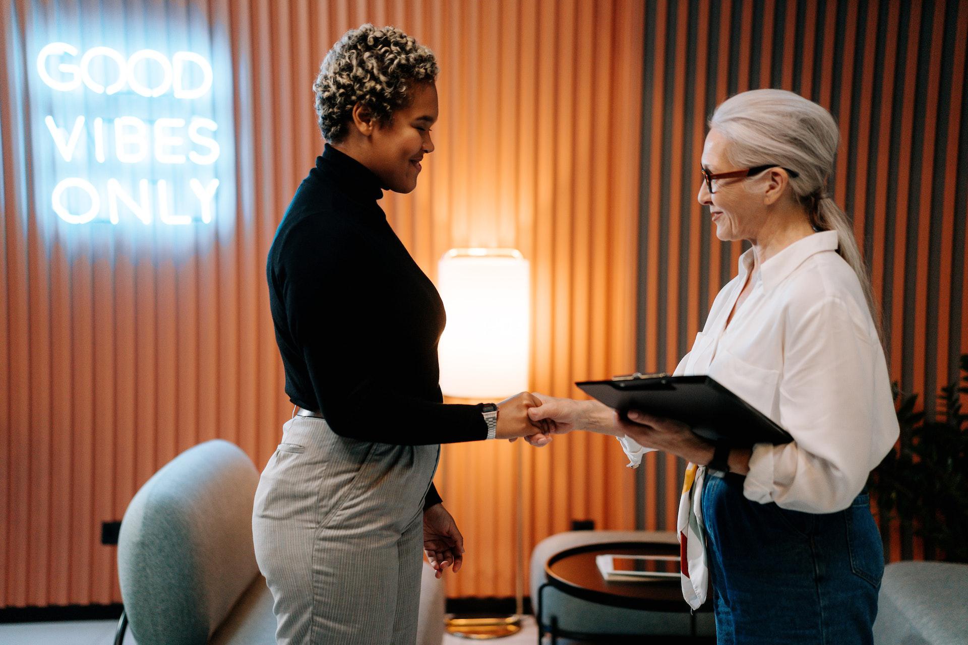 recruiter with candidate shaking hands