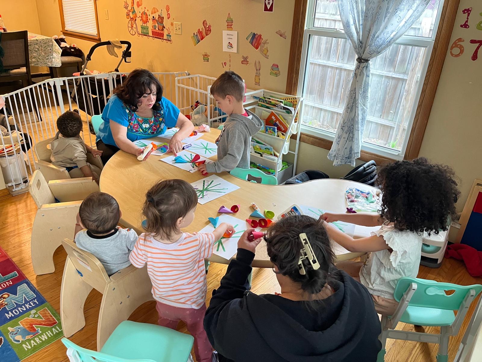 Children doing crafts and activities at the table