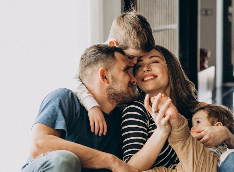 young-family-with-their-sons-home-having-fun-1674828739919.jpg