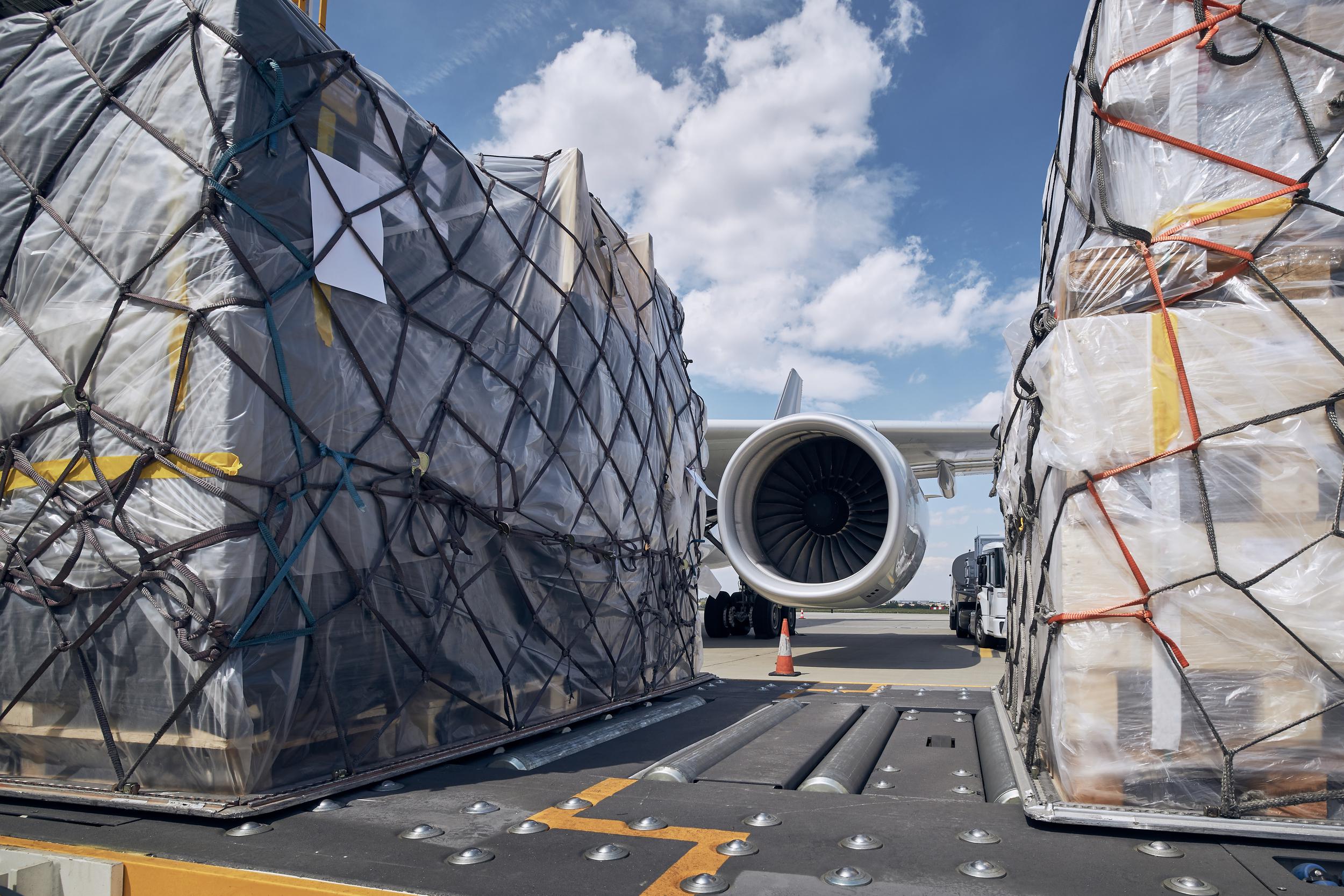 loading-of-cargo-containers-to-airplane-2023-11-27-05-27-30-utc.jpg