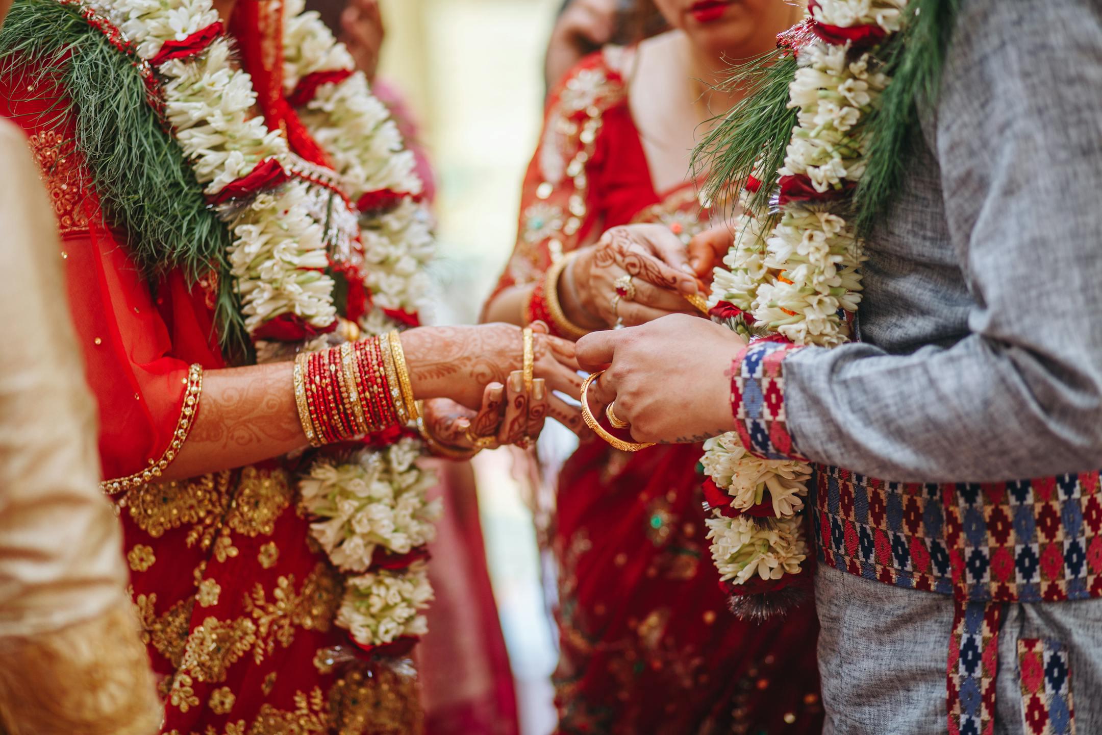 Close-up of a traditional Indian wedding ceremony with intricate attire and rituals.