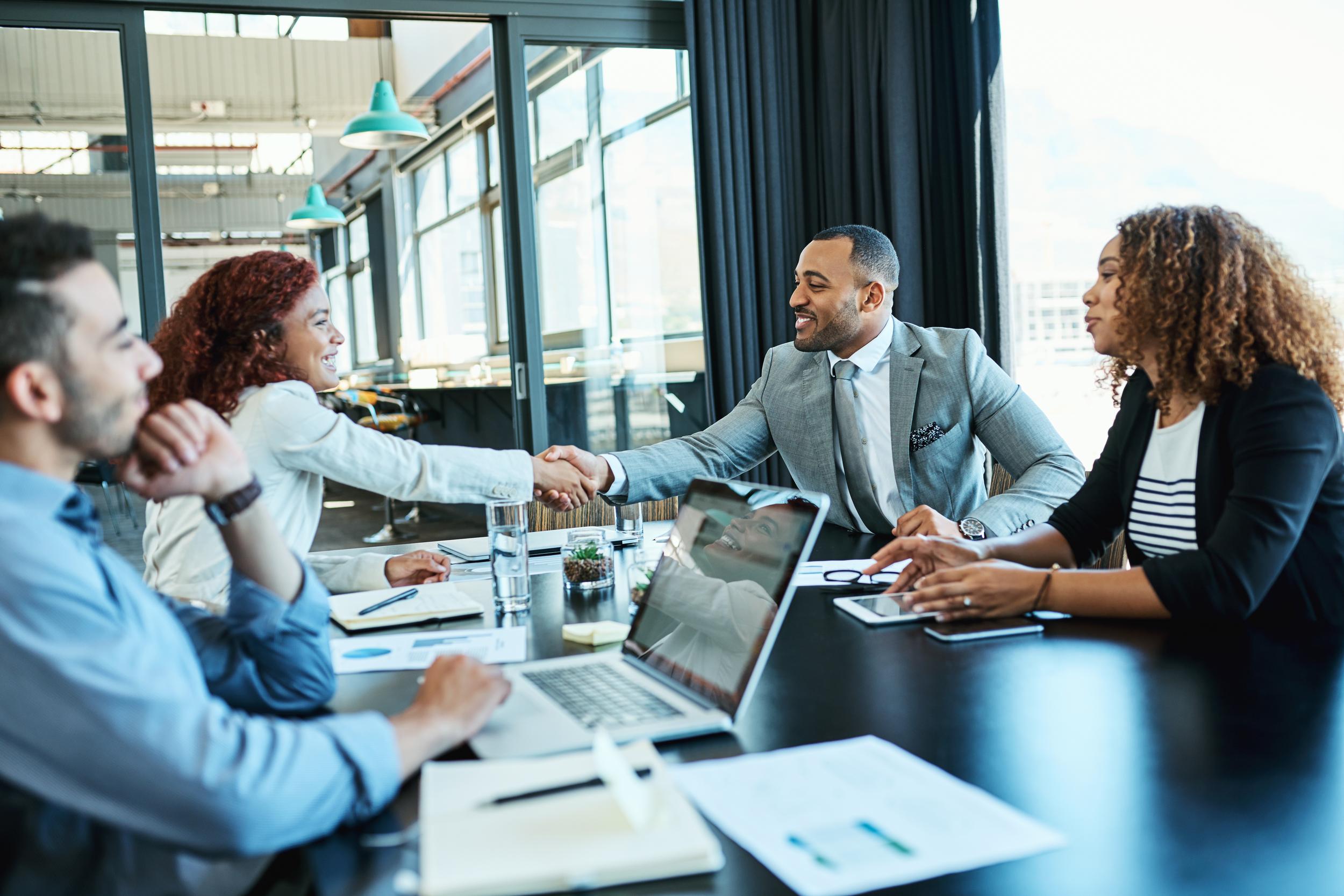 shot-of-businesspeople-shaking-hands-during-a-meet-2025-04-06-12-39-46-utc.jpg