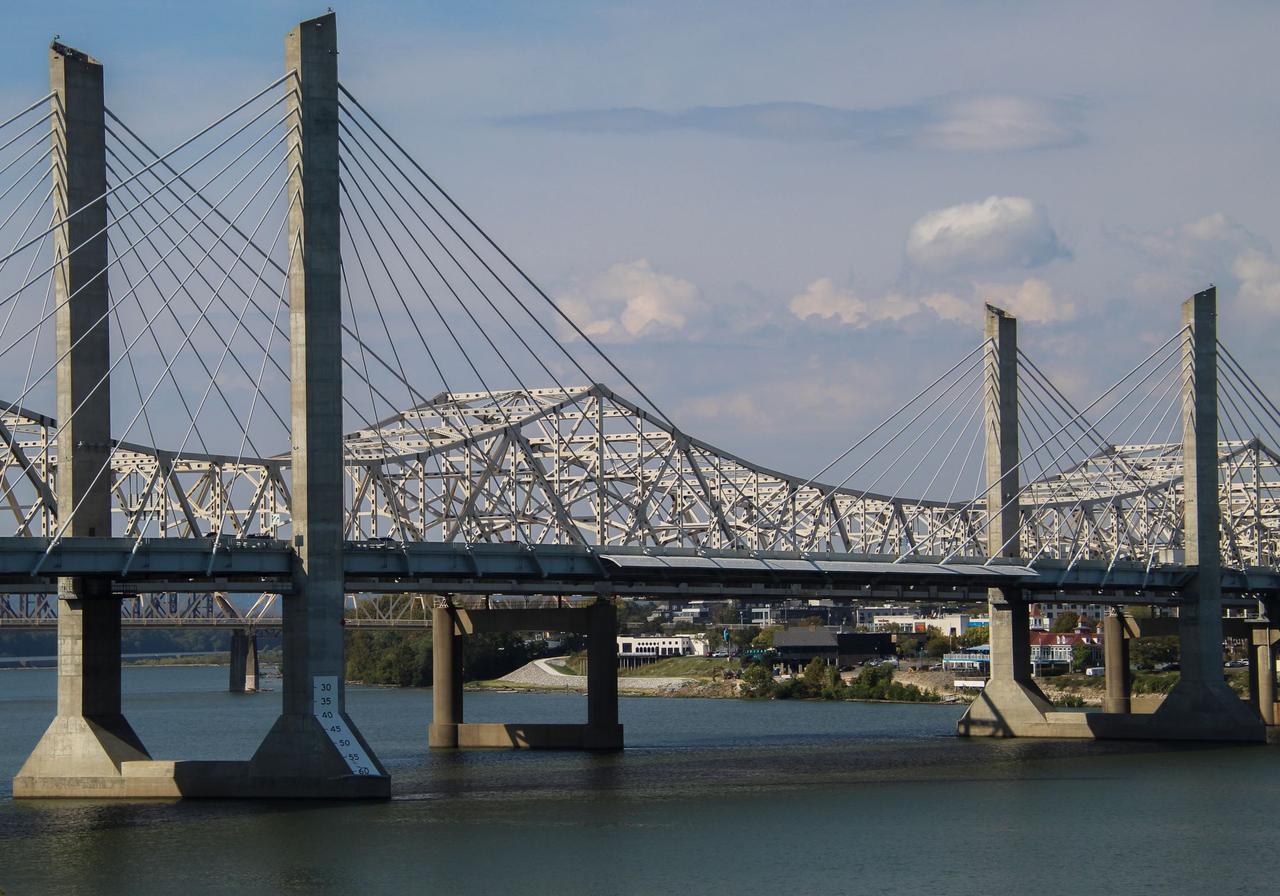 View of the cable-stayed bridge spanning the river, Louisville skyline in the background.