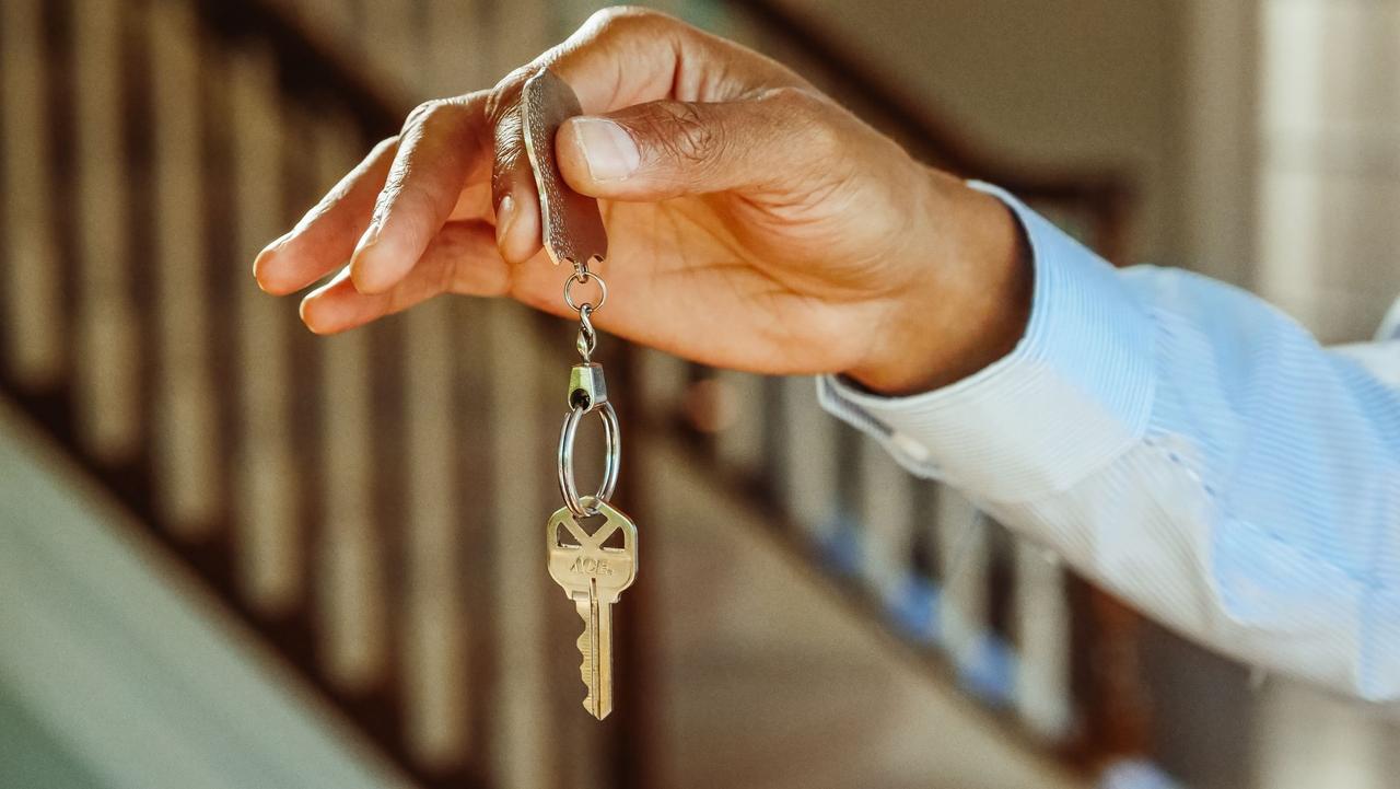 Rental house keys being handed over