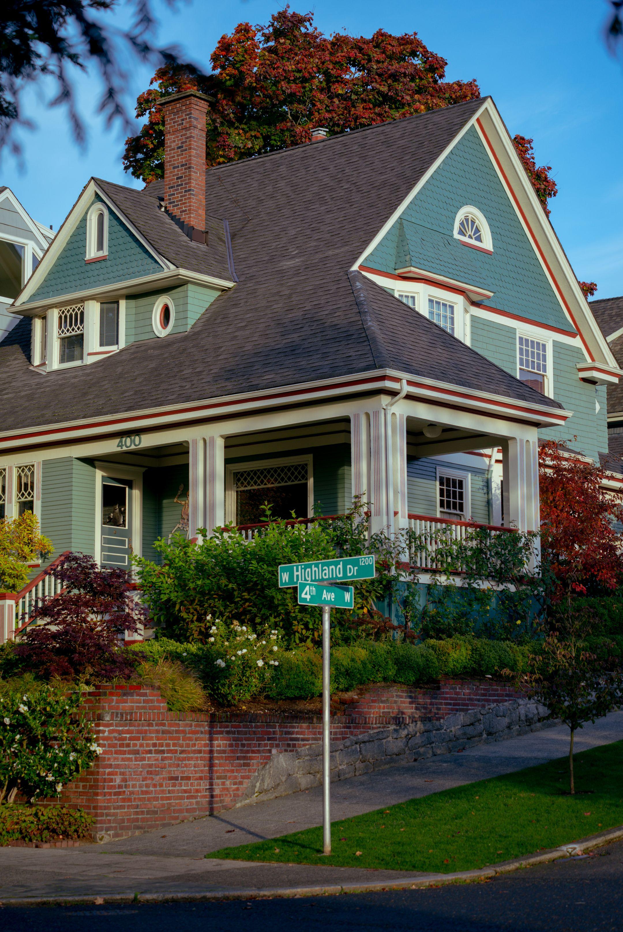 Quaint Craftsman home with traditional design in a Seattle neighborhood street view.