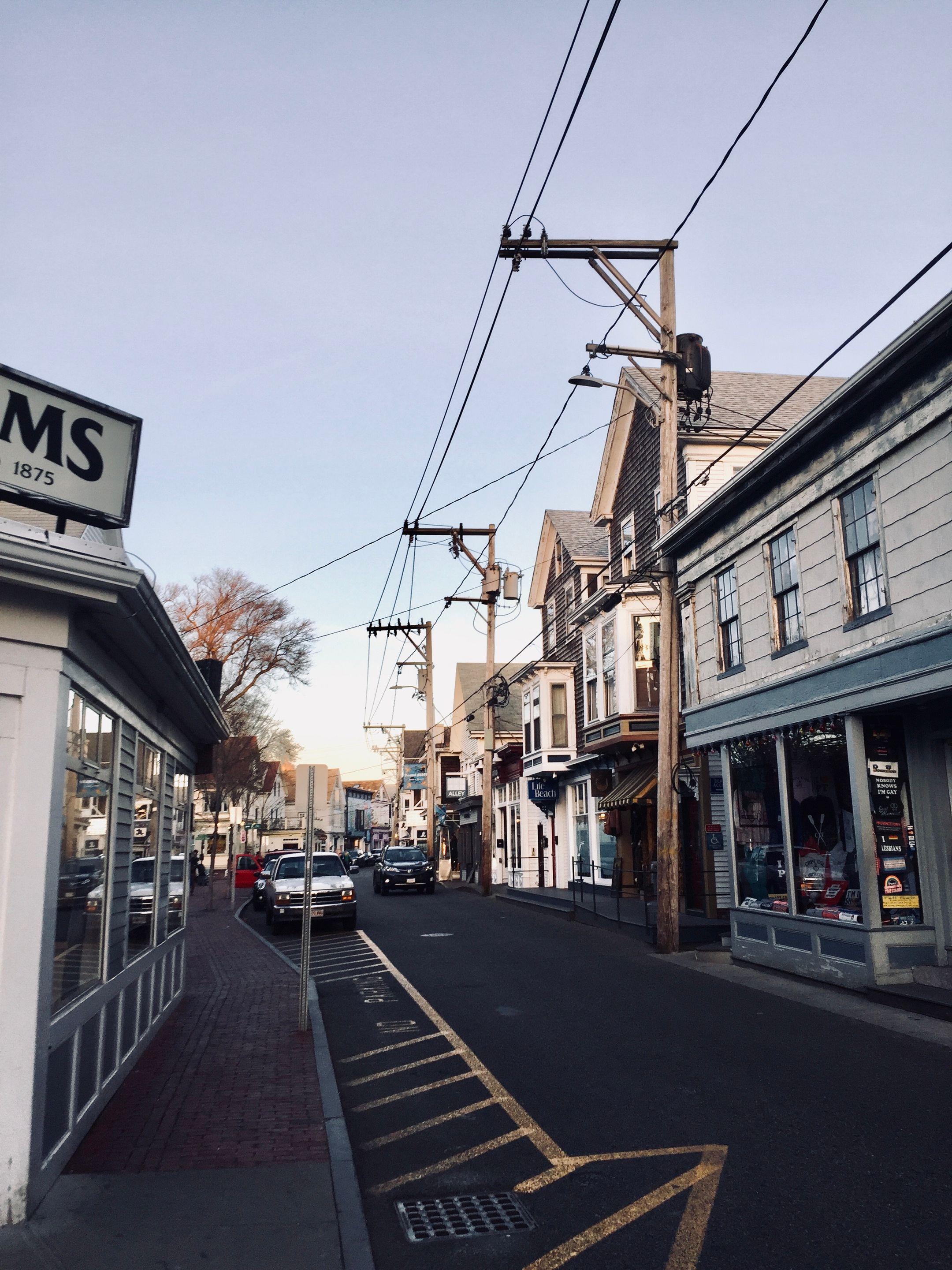 Explore a quaint city street lined with historic buildings and blue skies.