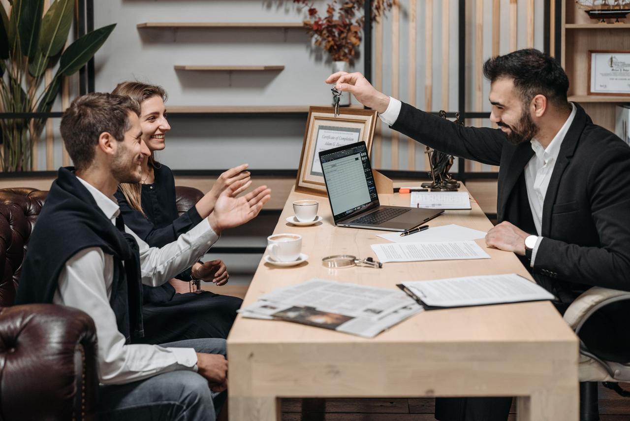 Real estate professionals meeting around a table