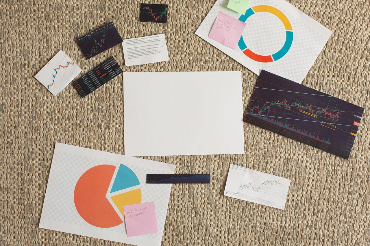 Charts and business cards spread on a table