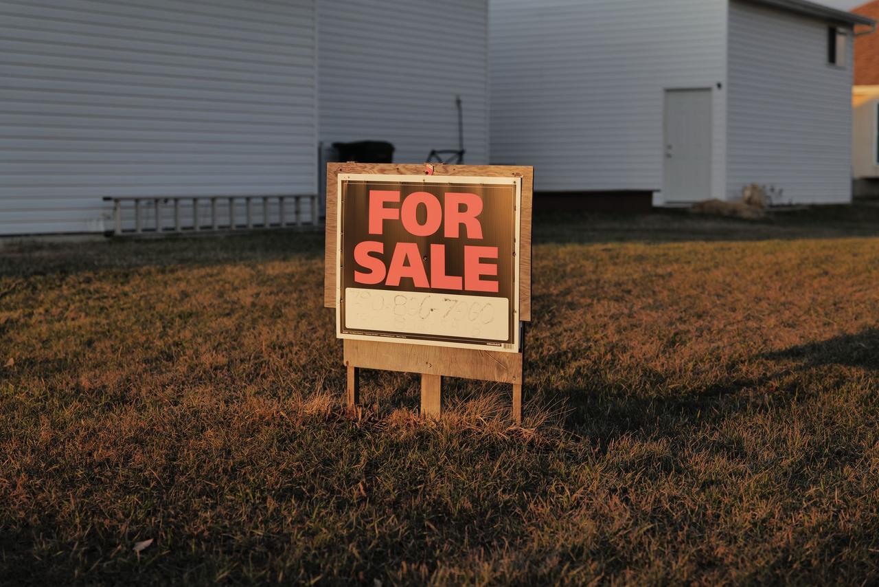 For sale sign posted on an empty lot