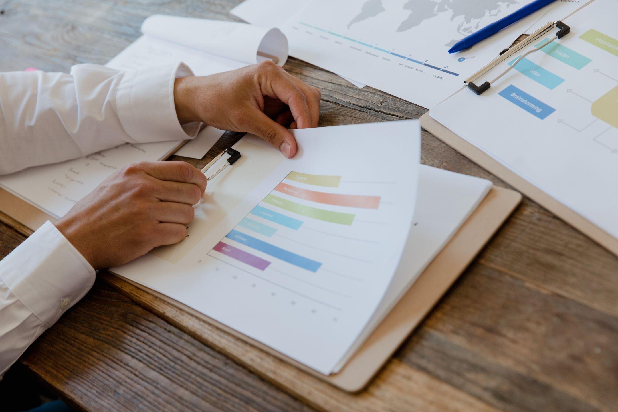 Reviewing a financial report at a desk