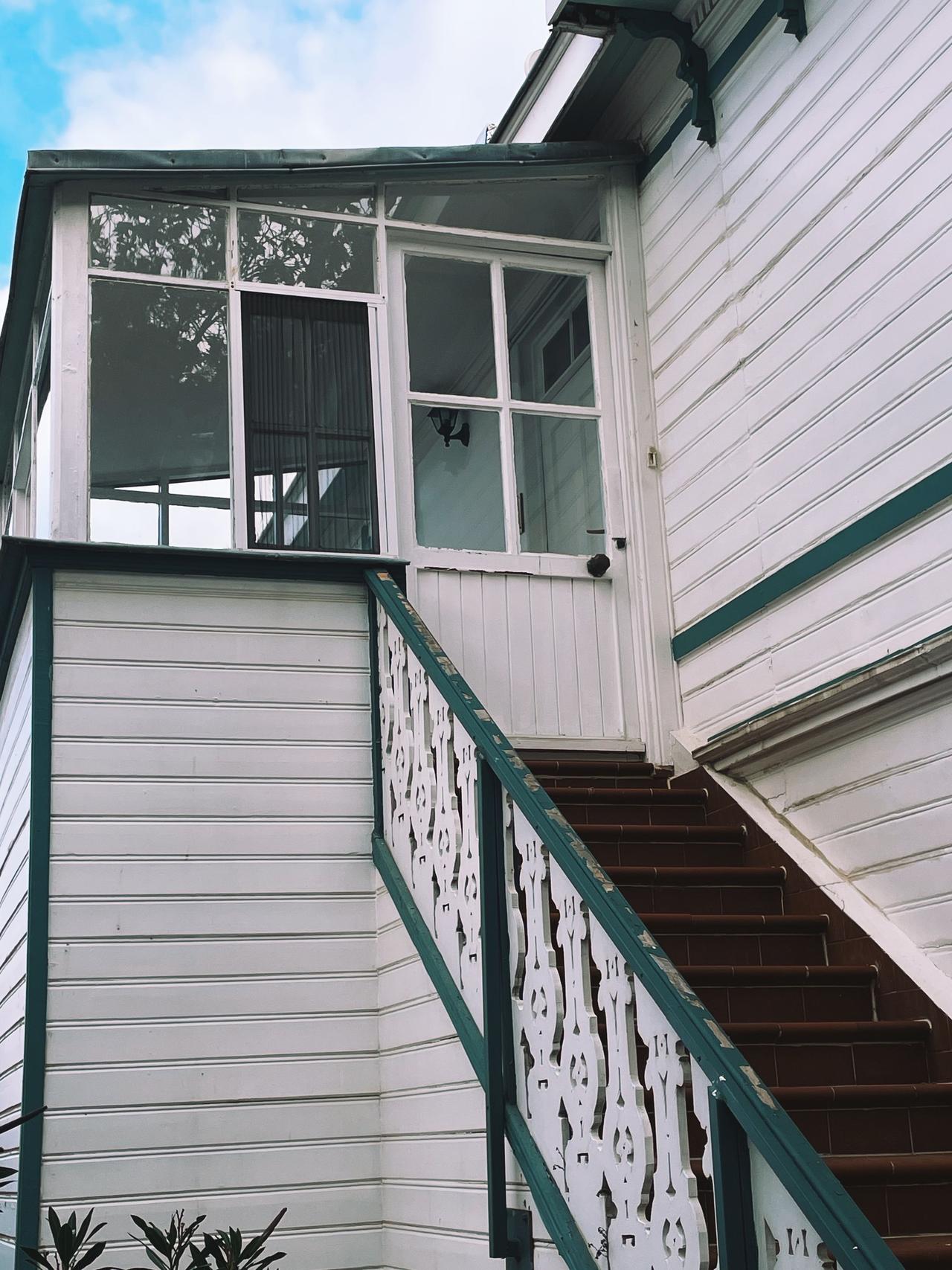 Older house with siding and front steps