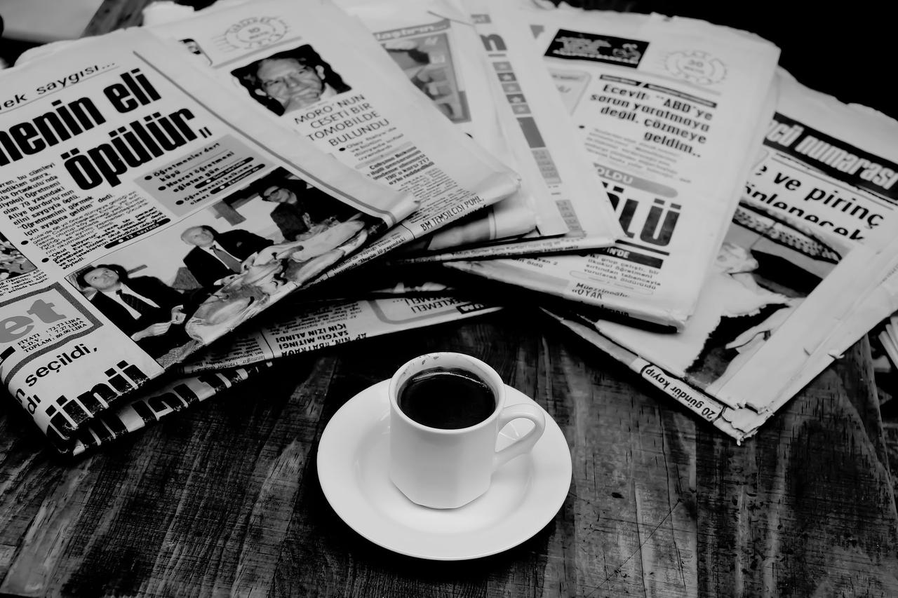 Newspapers and a cup of coffee