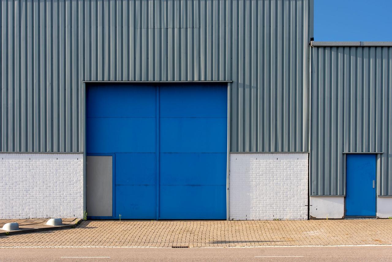 Industrial warehouse building with a loading door