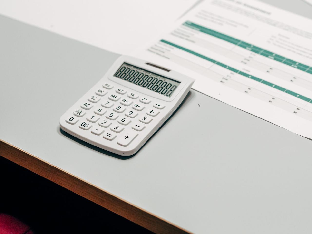 Calculator on top of a financial spreadsheet