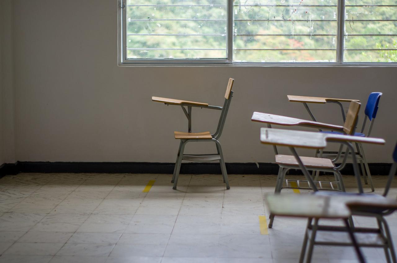 Empty chairs by a window in a quiet room