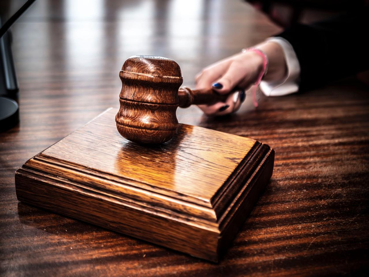 Judge's gavel on a wooden desk