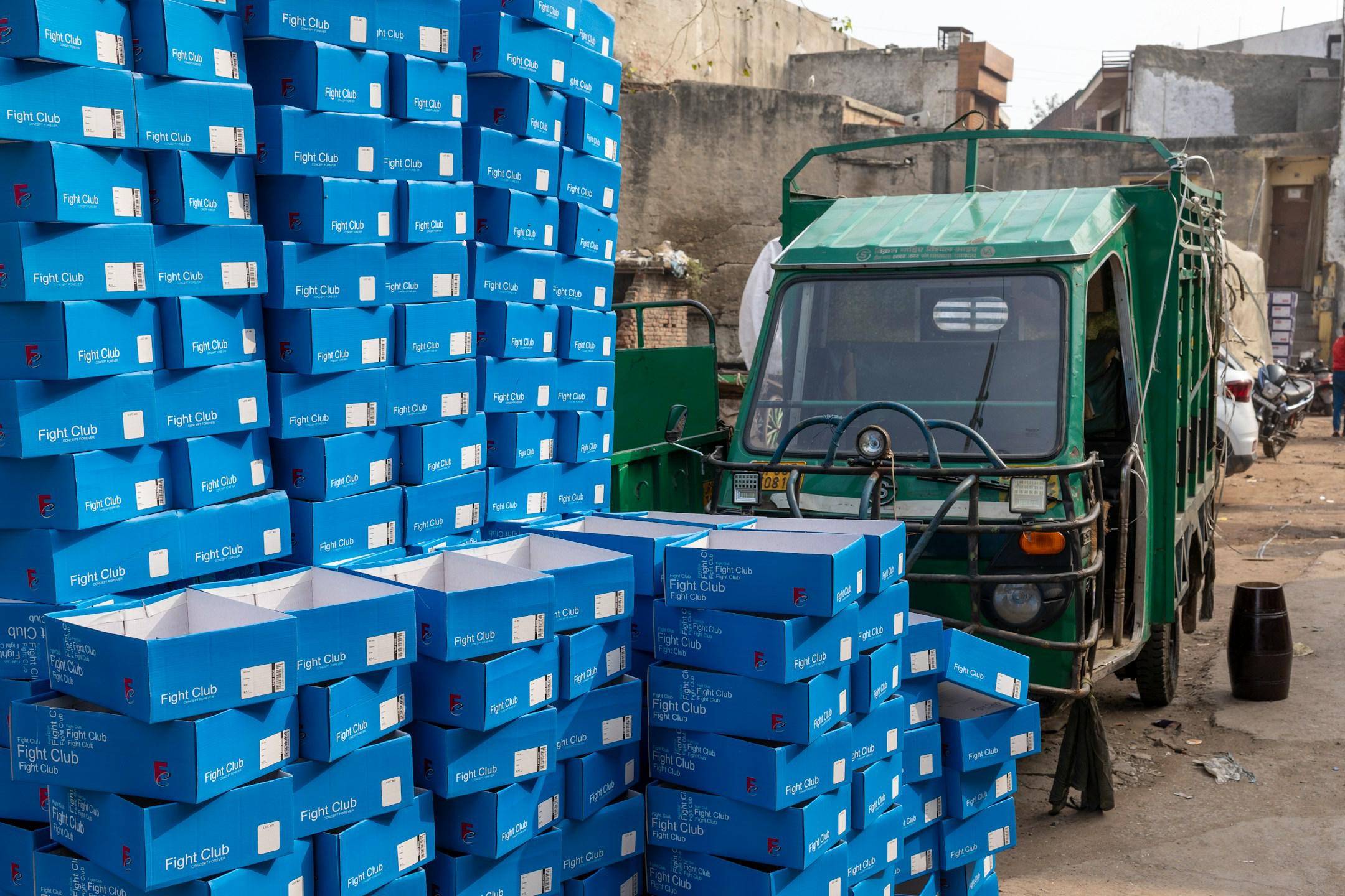 Empty shoeboxes outside a factory in India, Agra.